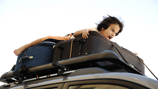 Horrible Parents Drive With Their Four Kids Strapped to the Car